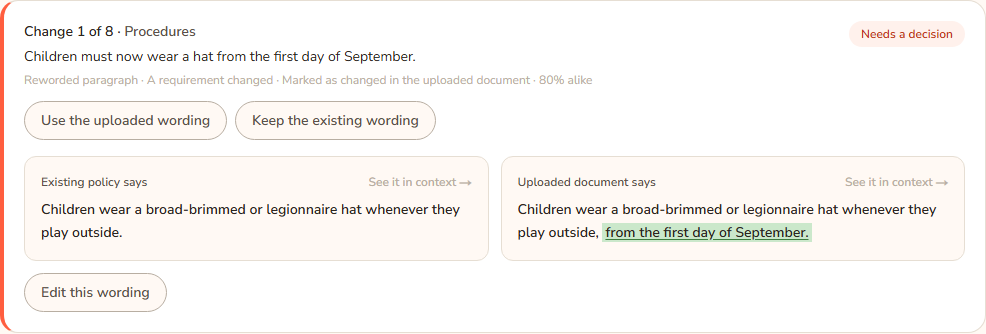 One change card. The title reads Change 1 with its heading and a note about the hat rule. The Existing policy says panel is on the left with removed words struck through, the Uploaded document says panel on the right with added words underlined, and the buttons Use the uploaded wording and Keep the existing wording below.